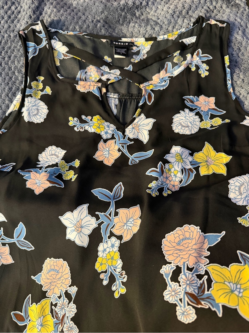 Floral tank top with criss cross on the chest